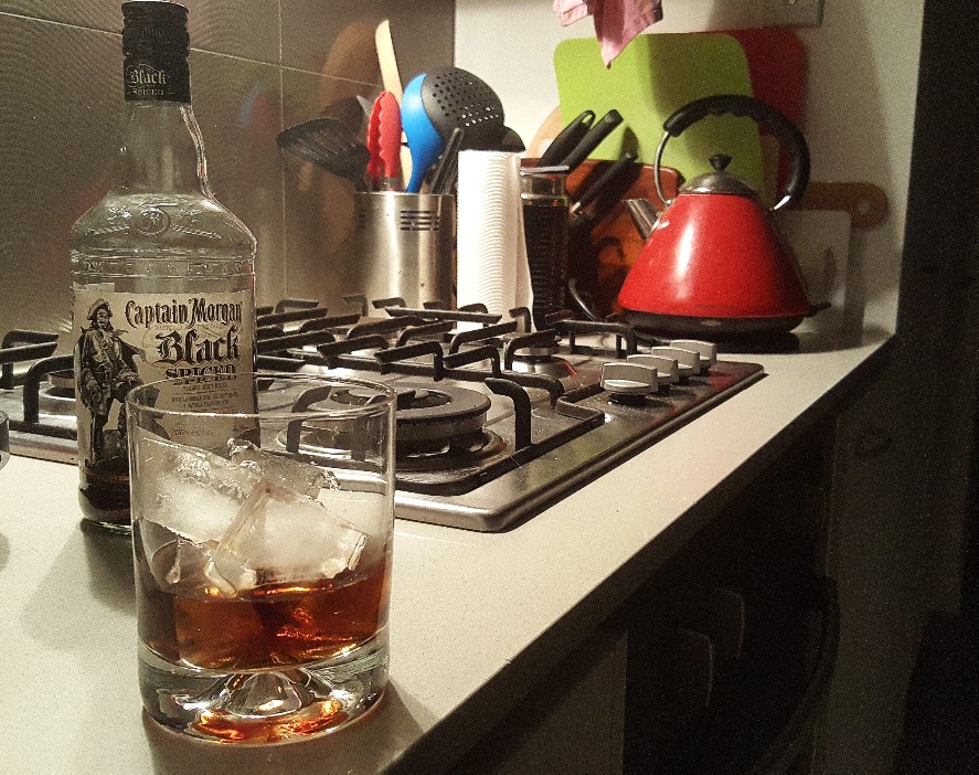 A glass of not champagne on a benchtop.