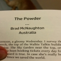 The start of a short story by Brad Mcnaughton, in a book, with a dog's butt in the background.